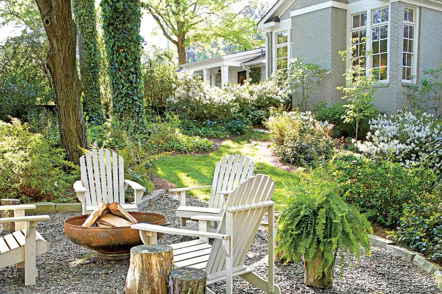 Adirondack Chairs, Gravel Surface, and Fire Pit Backyard