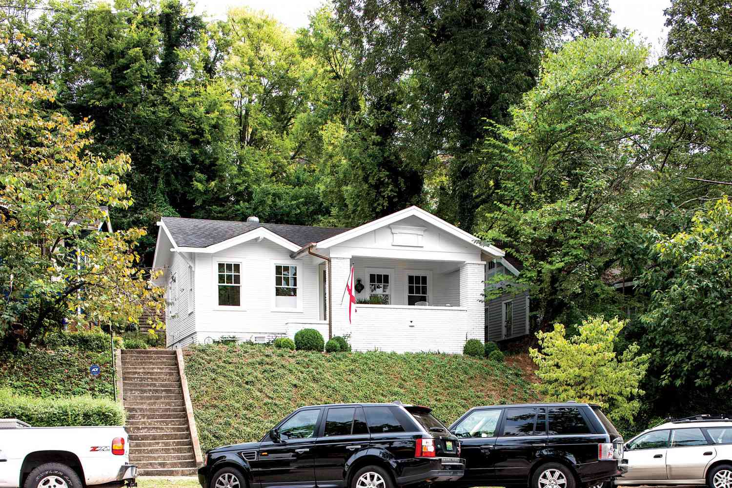 White House with Manicured Sloped Yard