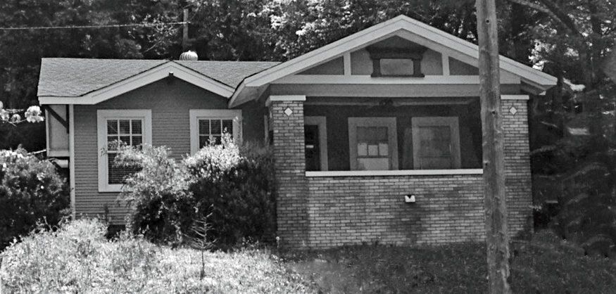 Brick Porch with Sloped Yard