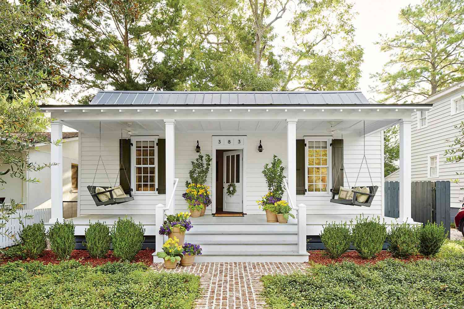 White Cottage Porch with Swings